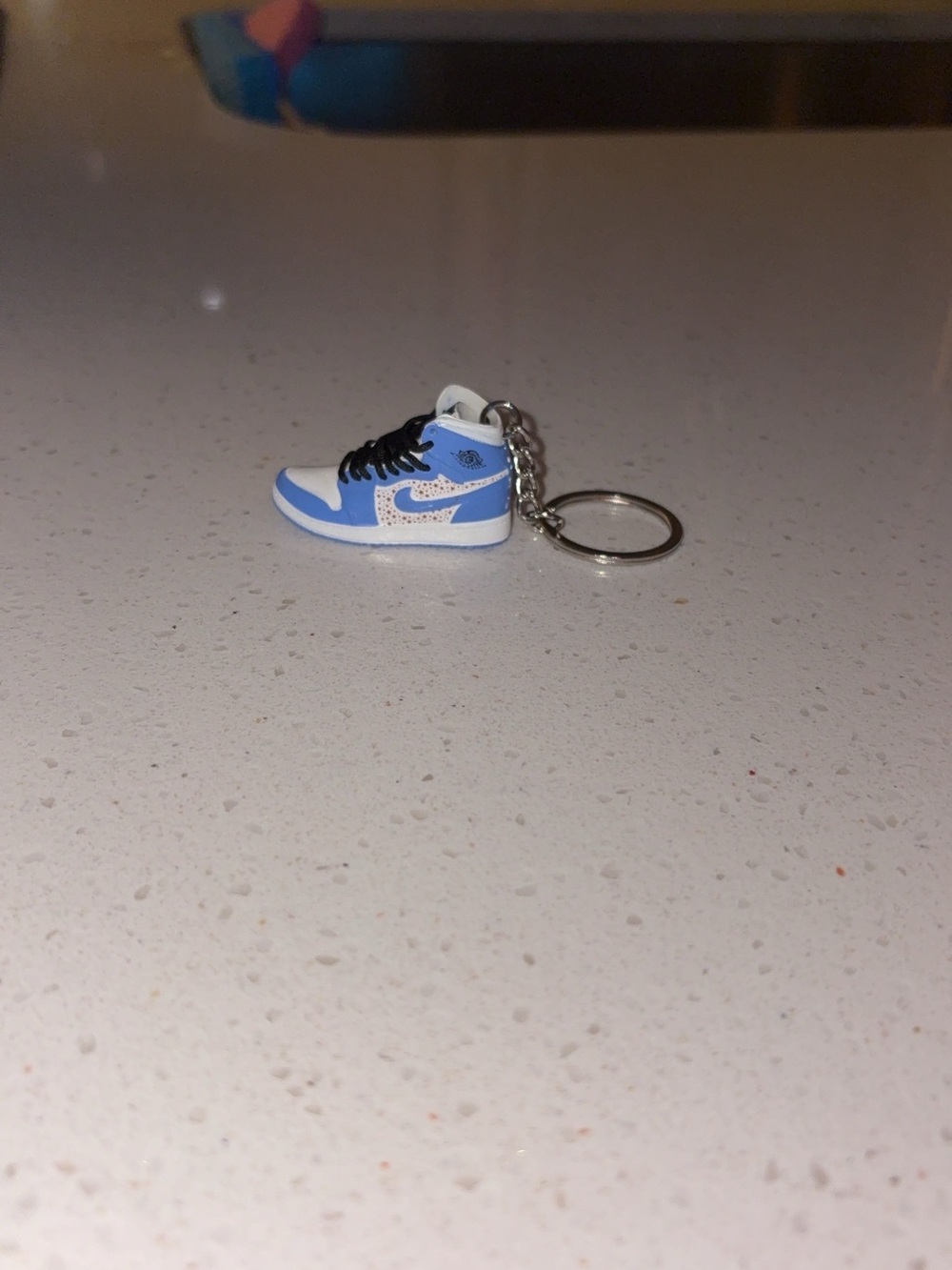 Nike Kids Light Blue and White Sneaker Keychain with Black Laces